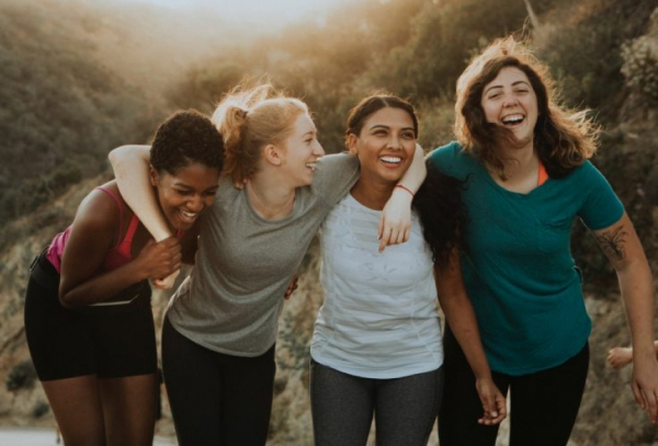 Four happy girl friends